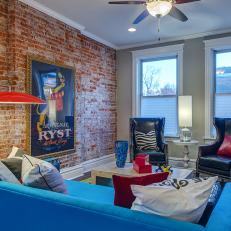 Funky Eclectic Living Room Features Mix of Brick, Leather and Stone 