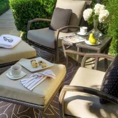 Transitional Outdoor Seating Area With Brown Chairs