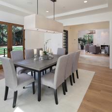 Contemporary Gray and White Dining Room With Backyard Access