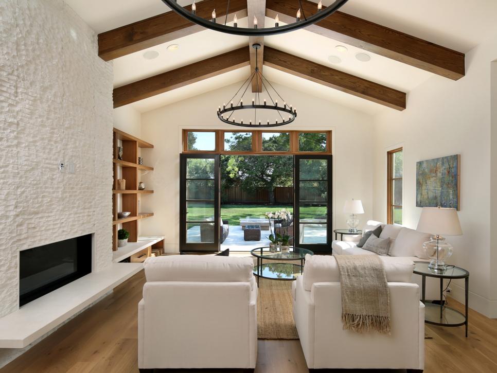 White Living Room With Vaulted Ceilings and Exposed Beams