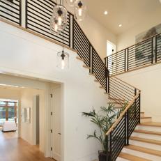Contemporary Staircase With Black Metal Railing