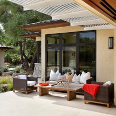 Peaceful Backyard Patio With Woven Outdoor Furniture