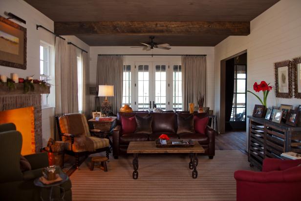 White Country Living Room With Wood Ceiling and Brown Sofa