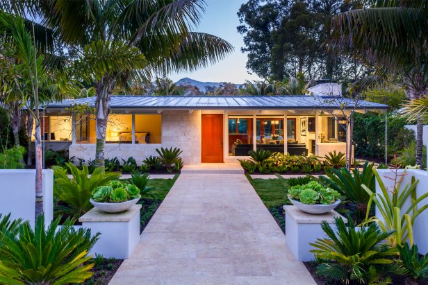 Neutral Beach Villa With Wood Door and Stone Walkway