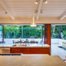 Modern Kitchen With Limestone Countertops and Mahogany Cabinetry