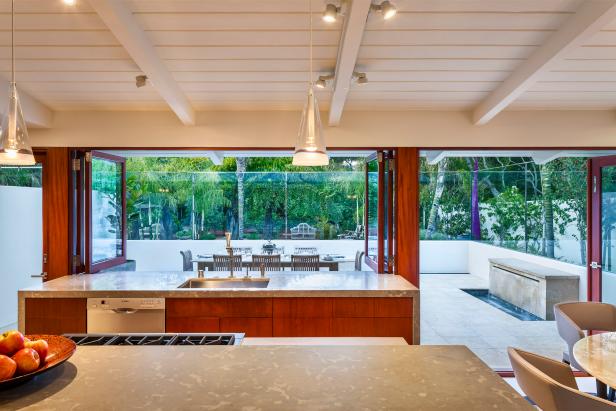 Modern Kitchen With Limestone Countertops And Mahogany Cabinetry