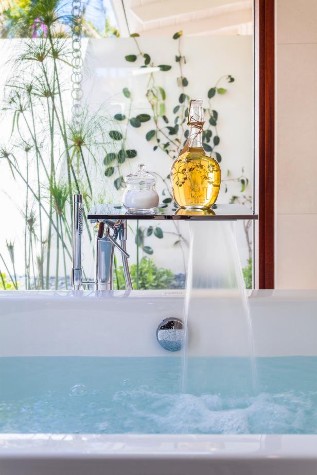 White Bathtub With Chrome Fixtures & Water Feature 