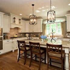 Traditional Kitchen With Creamy Cabinets and Large Island
