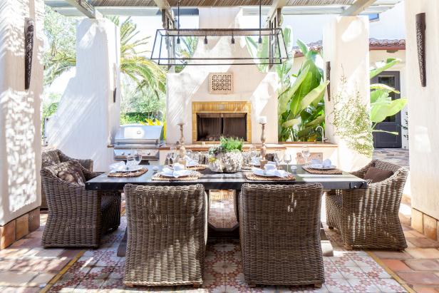 Outdoor Mediterranean-Style Dining Room With Brown Wicker Chairs