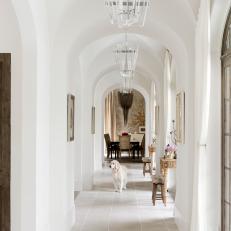Bright, Open Hallway With Arched Ceilings