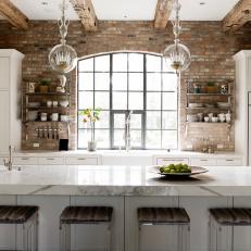 Marble Waterfall Island Wows in Charming Brick Kitchen