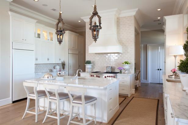 Neutral Open Kitchen With White Island and Brown Lantern Pendants