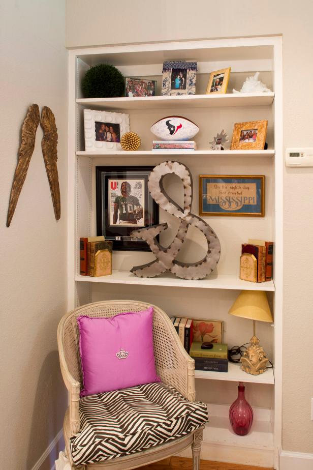 Photos, Football and Books Arranged on White Built-in Bookshelf