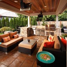 Covered Outdoor Kitchen With Sitting Area & Wood Ceiling
