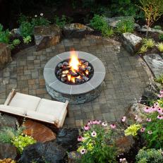 Backyard Patio With Gray Stone Fire Pit