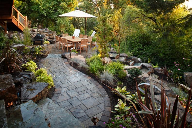 Backyard Patio With Gray Stone and Dining Area