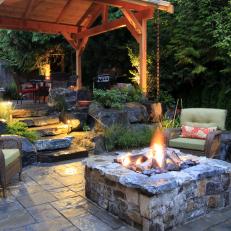 Rustic Backyard Area With Stone Fire Pit