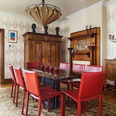 Eclectic Dining Room With Contemporary Red Chairs