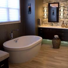 Contemporary Master Suite Bathroom Features Freestanding Tub and Floating Vanity
