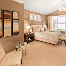Elegant Transitional Bedroom With Leather Tufted Seating and a View 