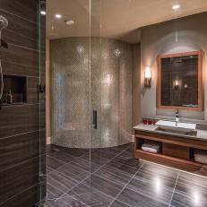 Glass Door Shower With Floating Vanity and Curved Accent Wall