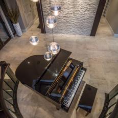 Upstairs View of Main Floor Foyer With Grand Piano & Contemporary Hanging Pendants