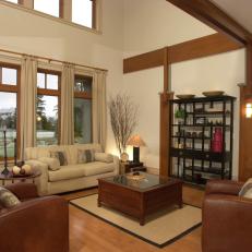 Neutral Contemporary Living Room With Wood Details and Brown Leather Armchairs 