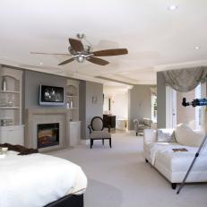 Gray and White Contemporary Master Bedroom Suit With Fireplace