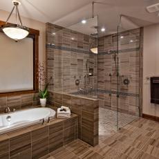 Contemporary Stone Bathroom Features Spa Shower With Multiple Showerheads