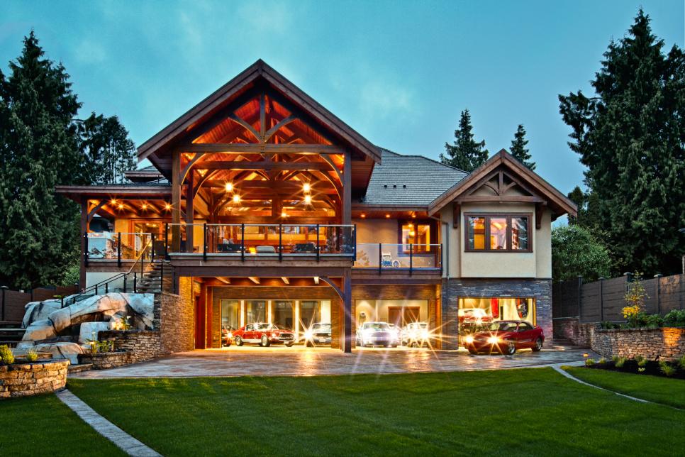 Exterior of Rustic Home With Large Garage & Sports Cars Below