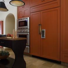 Traditional Kitchen With Vibrant Orange Cabinet Wall 