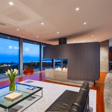 Modern Living Room Features Custom Fireplace & Large Sliding Glass Doors