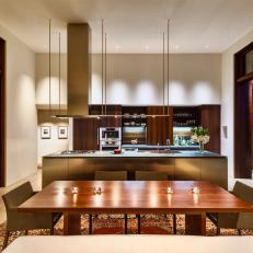 Elegant Modern Kitchen and Dining Area With Wood Table