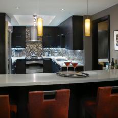 Modern Kitchen and Bar Area With Vibrant Backsplash