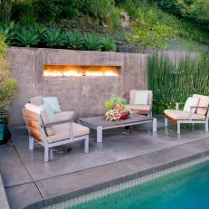 Elegant Patio With a Pool and Cozy Fireplace