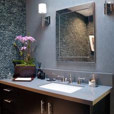 Contemporary Powder Room With River Rock Accent Wall