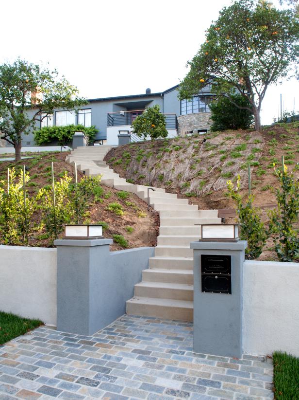 Gray Home Exterior With Long Stone Staircase