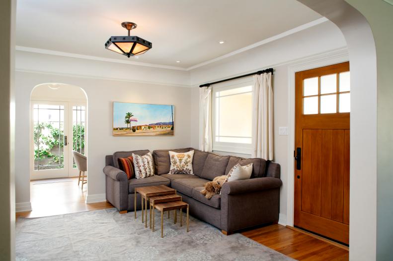 Remodeled Foyer with White Light Brown Sofa