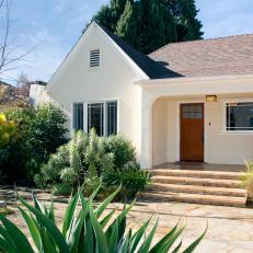 Charming Home Boasts Cream Colored Stucco Exterior