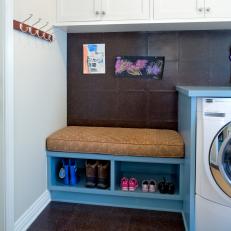Contemporary Laundry Room With Cork Wall and Flooring and Built-In Blue Storage