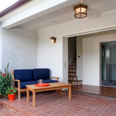 Covered Brick Patio With Pocket Doors
