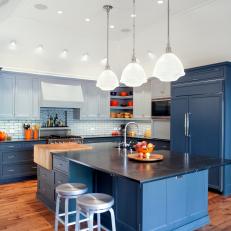 Open Kitchen With Blue Refrigerator & Cabinets