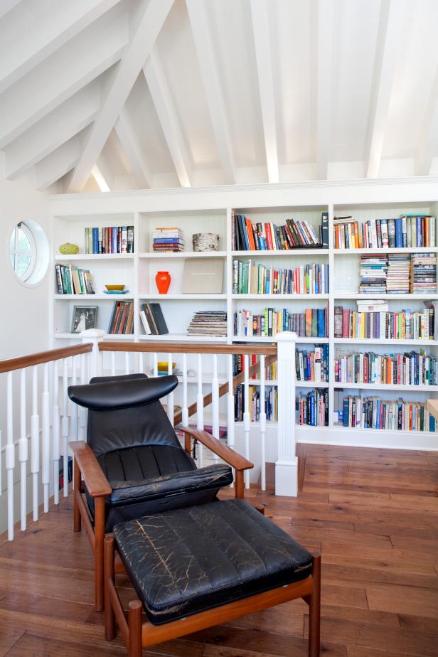 White Library With Vintage Leather Chair and Bookshelves