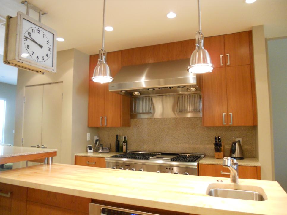 Neutral Open Kitchen With Gas Range & Two Stainless Steel Pendants