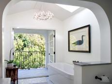 White Bathroom With Glass Chandelier, Arched Wall & Duck Art