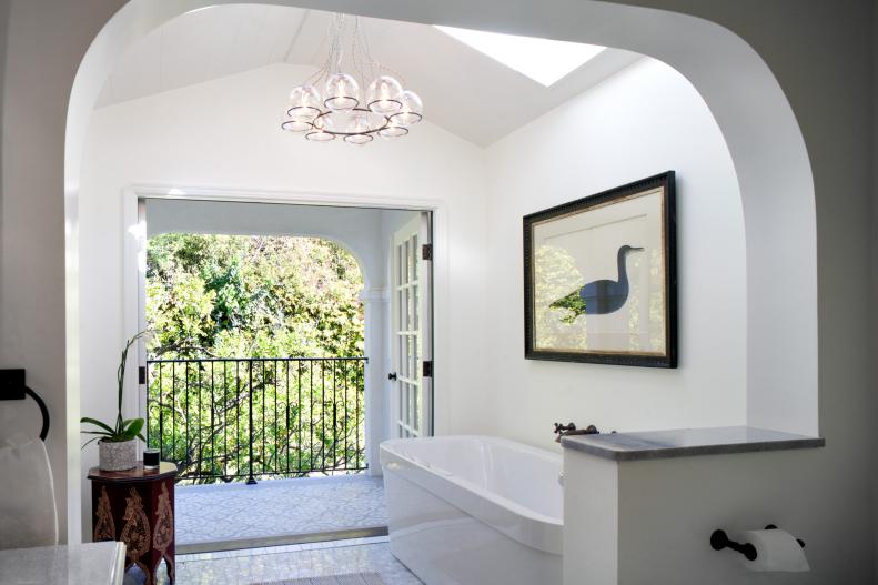 White Bathroom With Glass Chandelier, Arched Wall & Duck Art