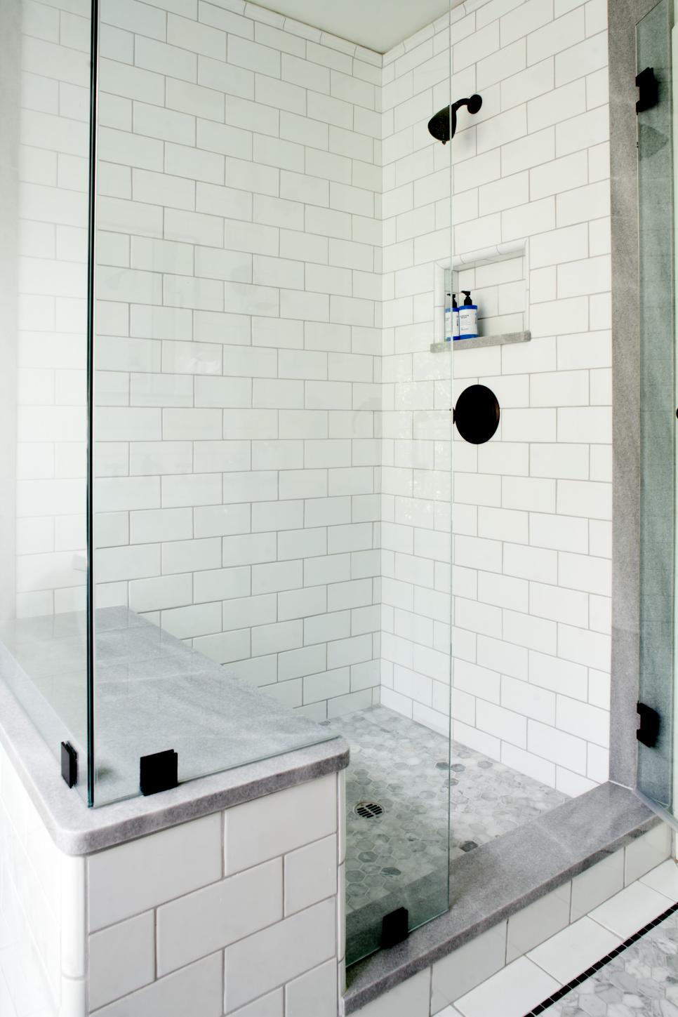 White Tile Walk-In Shower With Glass Walls and Sitting Bench | HGTV