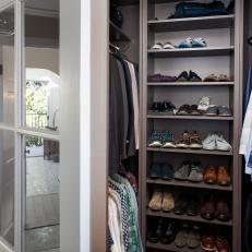 Organized Men's Walk-In Closet With Shoe Shelf and Hanging Bars