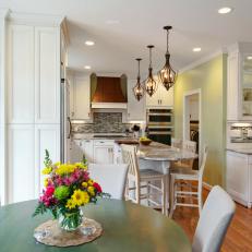 Bright Traditional Kitchen Features Green Circular Breakfast Table