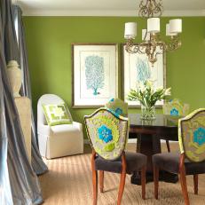 Transitional Dining Room Features Green and Blue Patterned Chairs